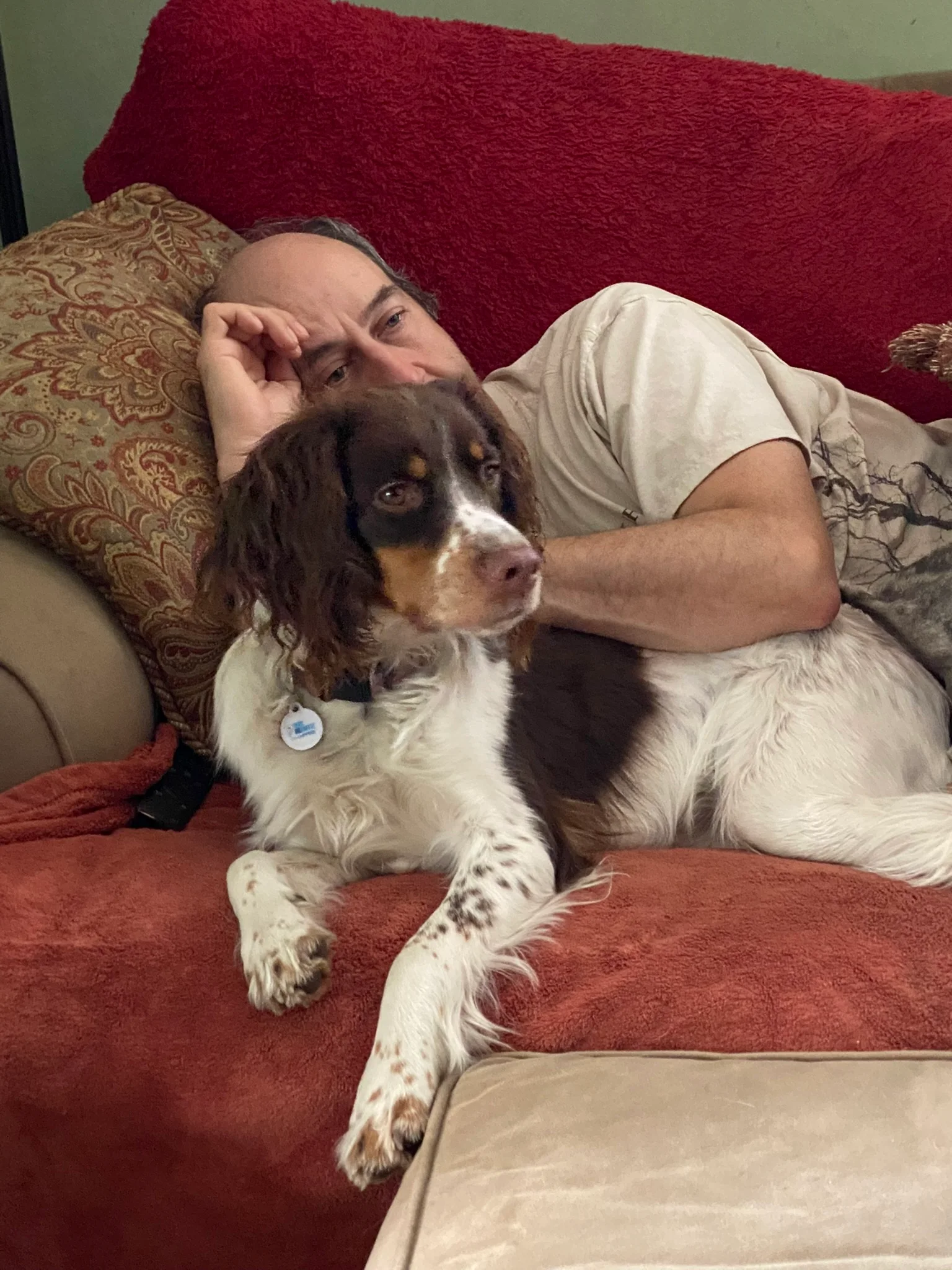 Ian relaxing at home with a dog